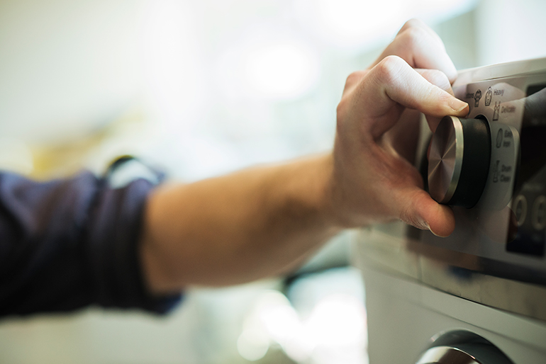 User turns on their washing machine